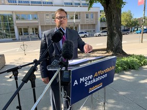 Saskatoon mayoral candidate Rob Norris announces he wants to shelve the $132-million downtown library project because of the economic impact of the COVID-19 pandemic. Norris made the announcement at city hall with the 54-year-old Frances Morrison Central Library in the background on Friday, Aug. 28, 2020. (Phil Tank/Saskatoon StarPhoenix)