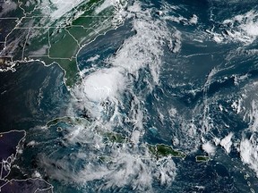 This RAMMB/NOAA satellite image obtained on August 2, 2020 at 12:10 UTC shows Tropical storm Isaias off the US southeast coast of Florida in the Atlantic Ocean.