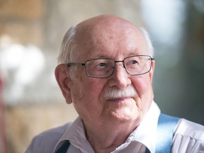 Marian Chateau resident August Arndt sits outside of the front entrance to the seniors complex in Regina, Saskatchewan on August 17, 2020.