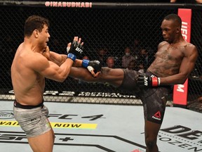 Israel Adesanya of Nigeria kicks Paulo Costa of Brazil in their middleweight championship bout during UFC 253 inside Flash Forum on UFC Fight Island on September 27, 2020 in Abu Dhabi, United Arab Emirates.