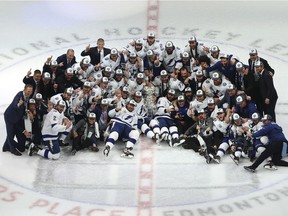 The Tampa Bay Lightning - including Saskatoon native Luke Schenn (No. 2; bottom left) pose for their team photo with the Stanley Cup following the series-winning victory over the Dallas Stars in Game Six of the 2020 NHL Stanley Cup Final at Rogers Place on September 28, 2020 in Edmonton, Alberta, Canada.