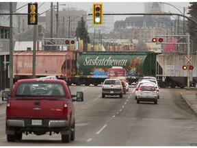 A train crosses 22nd Street West with the Delta Bessborough Hotel in the background in this photo taken on Oct. 28, 2016.