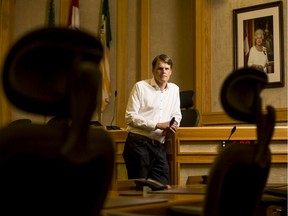 Saskatoon Mayor Charlie Clark stands in the Council Chamber.