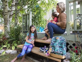 SASKATOON, SASK.: SEPTEMBER 05, 2020- (L to R) Mary McDonald, Bonnie McDonald and their mother Meghan McDonald sit for a portrait in their backyard in Saskatoon, Saturday, September, 5, 2020. Kayle Neis/Saskatoon StarPhoenix