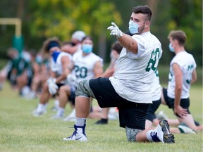 Huskies offensive lineman Noah Zerr warms up before a football practice at the University of Saskatchewan earlier this fall.