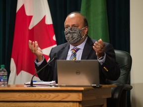 Saskatchewan's chief medical health officer Dr. Saqib Shahab, right, speaks to media regarding the COVID-19 pandemic.