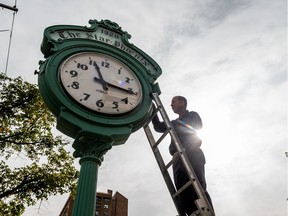 Ron Wiebe checks the light bulbs in the StarPhoenix clock. It turns 100 years old on Oct. 6, and is Saskatoon's oldest Great War memorial.