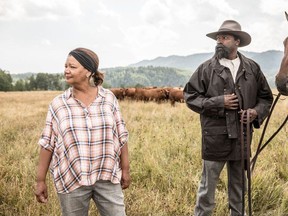 Actor and rodeo athlete Fred Whitfield, right, portraying Alberta rancher John Ware during a break in filming of Cheryl Foggo's, left, 2020 documentary John Ware Reclaimed. Shaun Robinson/Submitted by National Film Board of Canada