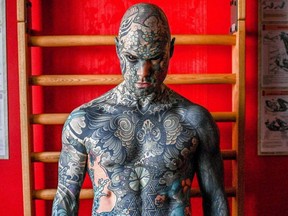 French primary school teacher and tattoo enthusiast Sylvain Helaine, known as Freaky Hoody, poses during a photo session in Palaiseau, a south of Paris suburb, on September 22, 2020.