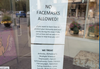 A screen grab of a photo posted to the r/Saskatoon Reddit of a sign posted in the VitaJuwel storefront in Saskatoon asking customers not to wear masks inside.