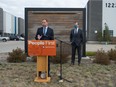 Saskatchewan New Democratic Party Leader Ryan Meili speaks to media during a campaign news conference held at the Global Transportation Hub near Regina on Oct. 2, 2020. NDP MLA Trent Wotherspoon stands behind.