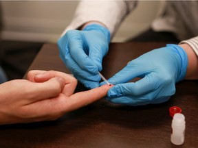 An HIV rapid test being performed at Saskatoon Sexual Health. The test can give patients an HIV diagnosis in minutes with just a quick prick.