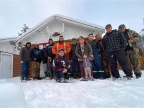 About a dozen people volunteered to clear a path through roughly 100 kilometres of snow-and-tree-covered road to Carswell Lake to rescue a family stranded by a snowstorm. Provided photo