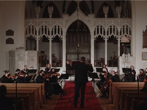 Conductor Eric Paetkau leads the Saskatoon Symphony Orchestra in a socially-distanced performance at St. John's Cathedral in Saskatoon during the fall of the 2020/2021 season.