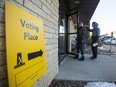 Community members enter a polling station in Silverspring to vote in the provincial election in Saskatoon, SK on Monday, October 26, 2020.