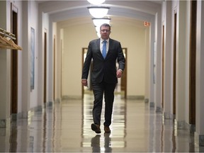 Premier Scott Moe walks down the hallway at the Saskatchewan Legislative Building on his way to a news conference on the day after the the provincial election on Oct. 27, 2020.