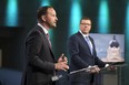 Saskatchewan Party Leader Scott Moe, right, and NDP Leader Ryan Meili, left, speak during the Leaders' Debate at the Provincial Archives in Regina on Wednesday Oct. 14, 2020.