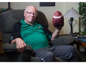 Long-time broadcaster John Lynch sits in his home in Regina,