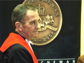 Robert D. Laing, as Chief Justice of the Saskatchewan Court of Queen's Bench, presenting commemorative metals for the Centennial of Sask. to recipients Jan. 19, 2006. He died on Oct. 10, 2020 at the age of 80.