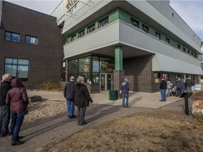 A line of people stretched out from Station 20 West as voters took advantage of advance polls on Monday, November 2, 2020.