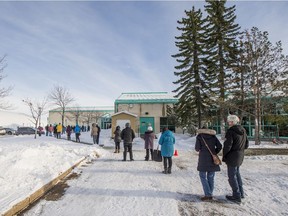 People line up outside of the Lakewood Civic Centre to cast their vote in the postponed municipal election in Saskatoon, SK on Friday, November 13, 2020.