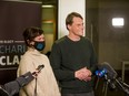 Mayor-elect Charlie Clark, right, and his wife Sarah Buhler speak with media after Clark was declared the winner of the municipal election.