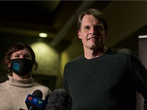 Mayor Charlie Clark, right, and his wife Sarah Buhler speak with media after being Clark was declared the winner of the municipal election in Saskatoon, SK on Friday, November 13, 2020.