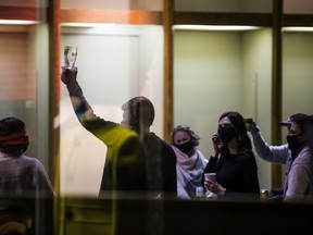 Charlie Clark lifts a glass in celebration after being declared the winner of the municipal election.