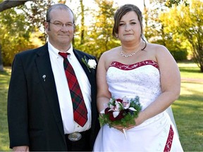 Brian Grant (left) and daughter Shannon Grant Tompkins pose at Tompkins' wedding in 2007. Tompkins started a social media group for Canadians to share their stories after her father contracted COVID-19 in November 2020.