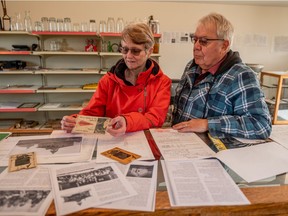 Beverly and Keith Hagen display some of the items they've collected in their Scotsguard museum on Oct. 9, 2020.