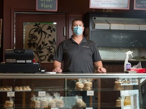 Bart Horseman, owner of the Indian Head bakery, stands in the front of the business in Indian Head, Sask. on Nov. 20, 2020. The business chose to shut down on Nov. 6, as a number of its employees contracted COVID-19.