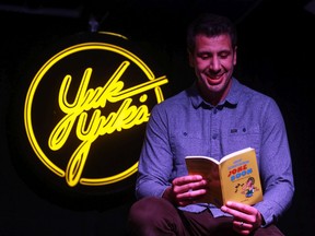 Saskatchewan comedian Joel Jeffrey, whose book "Great Saskatchewan Joke Book" pokes fun at his home province, stands on stage for a photo at Yuk Yuk's comedy club in Saskatoon.
