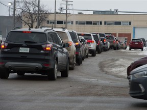 Vehicles are seen in a lineup for COVID-19 testing near the Pasqua Hospital in Regina, Saskatchewan.