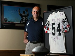 Former CFL linebacker Mark Kosmos, shown in 2006 shortly before he was inducted into the Ottawa Sports Hall of Fame, died Wednesday at age 75.