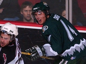 New Saskatoon Blades assistant coach Tyler Dietrich during his days with the WHL's Everett Silvertips with Blades head coach Mitch Love and goalie coach Jeff Harvey.