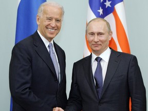 Russian Prime Minister Vladimir Putin (R) shakes hands with US Vice President Joe Biden (L) on March 10, 2011 during their meeting in Moscow.