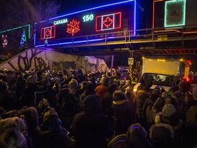 A crowd watches a train roll up during a stop by the annual Canadian Pacific Holiday Train in Saskatoon on Dec. 4, 2017. This year, the Holiday Train and concert will be a virtual event.