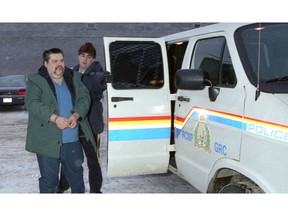 On Jan. 21, 1999, serial killer John Crawford lost an appeal for a new trial, following his conviction for the murders of three women. The skeletal remains of Shelley Napope, 16, Eva Taysup, 30, and Calinda Waterhen, 22, were found outside Saskatoon in October 1994. In this photo by the Leader-Post's Bryan Schlosser, Crawford is seen in police custody outside the Saskatchewan Court of Appeal in Regina. The three murders followed his killing of another woman in Lethbridge, Alberta, for which he served seven years in prison.