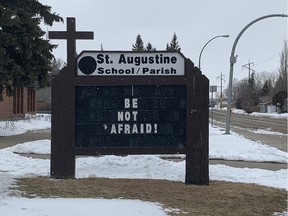 Sign outside St. Augustine School and Parish amid the COVID-19 pandemic in Saskatoon, Sask. on Wednesday, March 25, 2020.