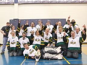 Members of the Humboldt Broncos Special Olympics floor hockey team celebrate a bronze medal.