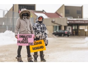 Chantelle and Drake Reimer (left to right) hold a protest outside the Saskatoon Correctional Centre to call on the Ministry of Corrections, Policing and Public Safety to do more to protect inmates from COVID-19. Her fiancé, Tyler Magnus, is in one of the overflow units at the jail. Photo taken in Saskatoon, SK on Tuesday, December 1, 2020.