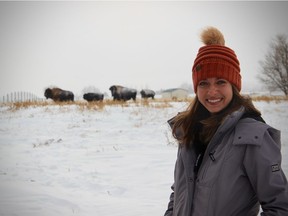 PhD student Miranda Zwiefelhofer with Wood Bison at the University of Saskatchewan's Livestock and Forage Centre of Excellence. (Photo by Eric Zwiefelhofer) (for Saskatoon StarPhoenix Young Innovators series, December 2020)