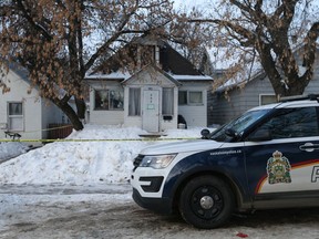 Saskatoon police taped off the area around 437 Avenue R South following a fatal altercation on Dec. 7, 2020. A 14-year-old boy was rushed from the home by ambulance but died in hospital. (Saskatoon StarPhoenix / Michelle Berg)
