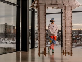 Local musician Gan (AKA respectfulchild) has a special art installation at the Remai Modern. "Falling leaves return to their roots" is an ongoing display that requires viewer participation. People have written messages on paper that Gan is attaching to the gate frame.