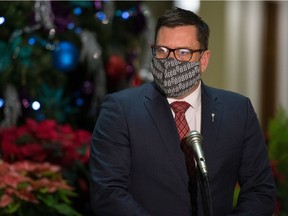 Saskatchewan Health Minister Paul Merriman is seen during a media scrum in the rotunda at the Saskatchewan Legislative Building in Regina, Saskatchewan on Dec. 9, 2020.