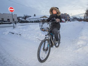 Saskatoon Cycles board member Kira Judge rides her bike in Saskatoon on Dec. 15, 2020.