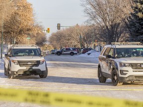 Police cruisers at the scene of a police-involved shooting in Saskatoon on Dec. 24, 2020.