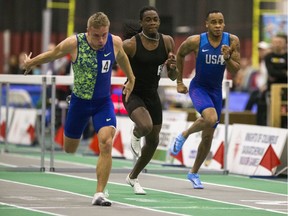 Chad Zallow (left), Eddie Lovett and Marcus Maxey race in the men's 60-metre hurdles invitational during last year's Knights of Columbus Indoor Games.