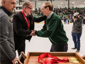 SASKATOON, SK--Feb. 29/2020 -- 0229 Sports Huskies Hockey

Huskie Men's hockey head coach Dave Adolph receives a gold metal from Merlis Belsher as team wins gold against the UBC in the Canada West final at Merlis Belsher Arena on the U of S Campus on Saturday, February 29th, 2020 in Saskatoon, SK.  Final Score: Huskies 3, UBC 1.