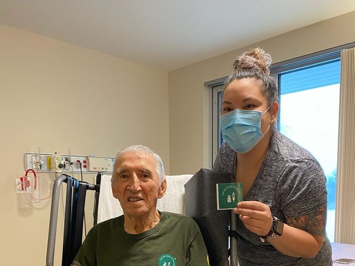  Jimmy Favel and his granddaughter, Brittany Favel, pose after both received doses of the Moderna vaccine on Tuesday, Jan. 5, 2021. Jimmy Favel lives in the Ile-a-la-Crosse Long Term Care facility and Brittany is a registered nurse. Ile-a-la-Crosse is a community of about 1,600 people in northern Saskatchewan, about 300 kilometres northwest of Prince Albert. (Saskatchewan Ministry of Health)